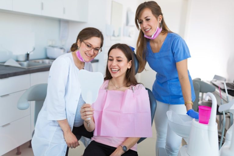 woman happy at the dental clinic